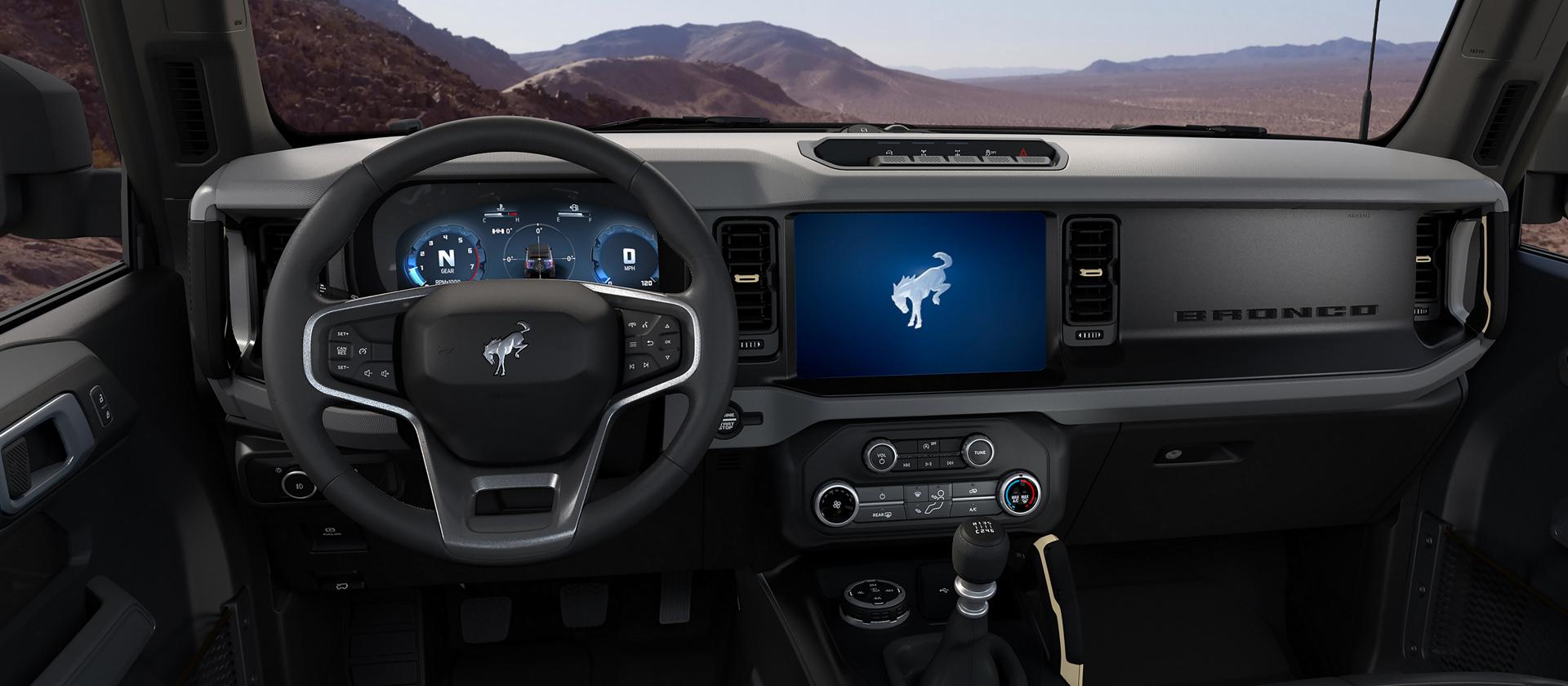 The dashboard of a 2026 Ford Bronco® SUV, showing the digital cluster and touchscreen