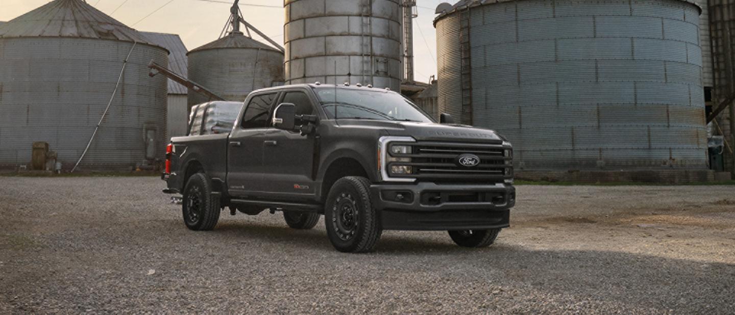 A Ford Super Duty parked at an industrial site.